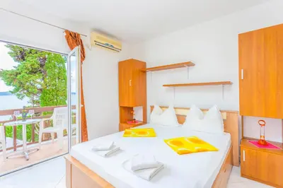 Krevet ili kreveti u jedinici u objektu APARTMANI GRBAVAC