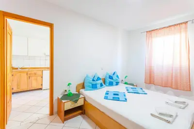 Krevet ili kreveti u jedinici u objektu APARTMANI GRBAVAC