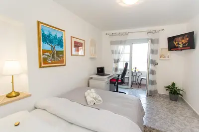 TV i/ili zabavni centar u objektu Apartments Desirée