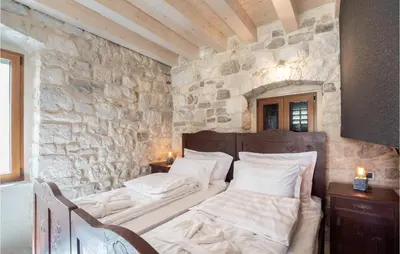Krevet ili kreveti u jedinici u objektu Awesome Home In Omis With House A Mountain View
