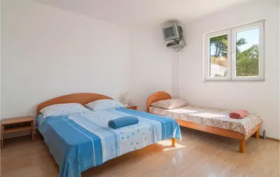 Krevet ili kreveti u jedinici u objektu Beach Front Apartment In Stanici With Wifi