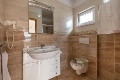 Kupaonica u objektu Apartment Aria with private heated pool