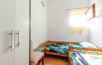 Krevet ili kreveti u jedinici u objektu 2 Bedroom Awesome Apartment In Lokva Rogoznica