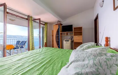 Krevet ili kreveti u jedinici u objektu 2 Bedroom Awesome Apartment In Lokva Rogoznica