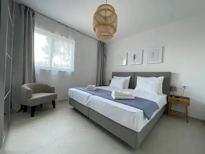 Krevet ili kreveti u jedinici u objektu Exclusive Seafront Suite with jacuzzi