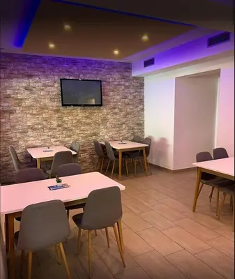 TV i/ili zabavni centar u objektu Beach Apartment Val