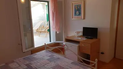 TV i/ili zabavni centar u objektu Room in Bol with terrace, air conditioning, WiFi, washing machine 3416-6