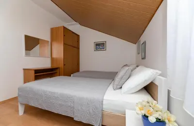 Krevet ili kreveti u jedinici u objektu Apartment in Supetar with sea view, balcony, air conditioning, W-LAN 3553-3