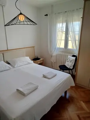 Krevet ili kreveti u jedinici u objektu ROOMS LUCE 1 & SUPETAR