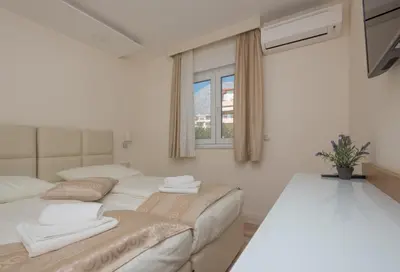 Krevet ili kreveti u jedinici u objektu Promajna Leone Erceg Apartments
