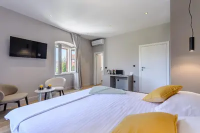 Krevet ili kreveti u jedinici u objektu Dora rooms and studios