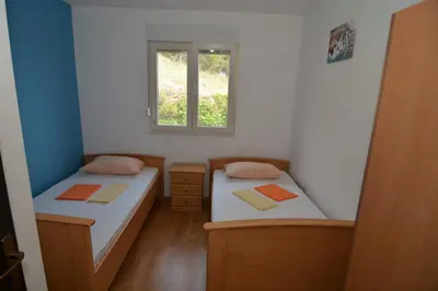 Krevet ili kreveti u jedinici u objektu Family apartment and terrace with a sea view
