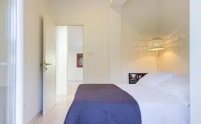 Krevet ili kreveti u jedinici u objektu Villa Ume - heated pool, sauna, volleyball court