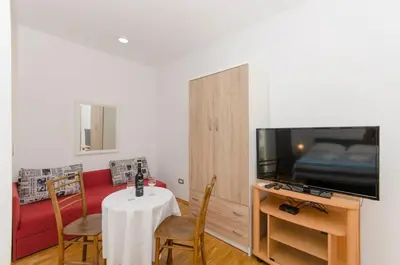TV i/ili zabavni centar u objektu Apartments Mira Beachfront Bliss