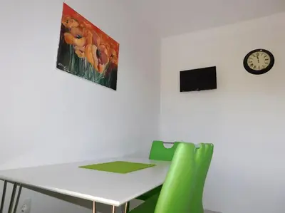 TV i/ili zabavni centar u objektu Apartments Coloured