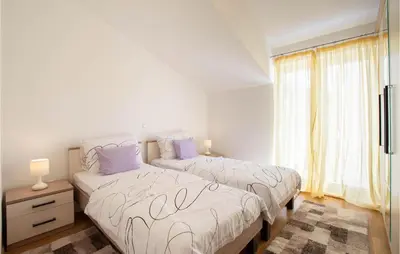 Krevet ili kreveti u jedinici u objektu 2 Bedroom Beautiful Apartment In Podstrana