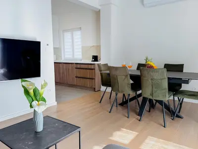 TV i/ili zabavni centar u objektu Apartments Piscina-Grey