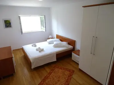 Krevet ili kreveti u jedinici u objektu 6 pax Apertment ON THE BEACH with Terrace, Sea view, Garden, Parking ensured, first floor