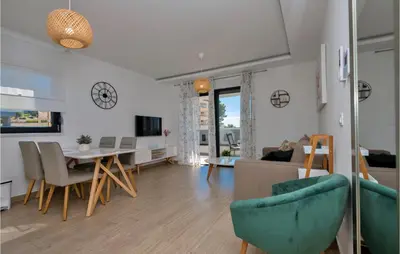 TV i/ili zabavni centar u objektu Lovely Apartment In Baska Voda