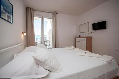 Krevet ili kreveti u jedinici u objektu Apartments and Rooms Nikola