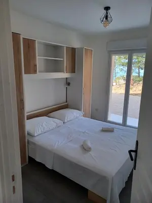 Krevet ili kreveti u jedinici u objektu APARTMANI JELIĆ