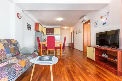 TV i/ili zabavni centar u objektu Apartments Sunset
