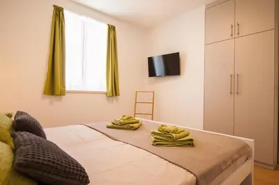 Krevet ili kreveti u jedinici u objektu Apartment CasArosa - Free Private Parking