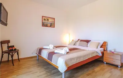 Krevet ili kreveti u jedinici u objektu Four-Bedroom Holiday Home In Bast