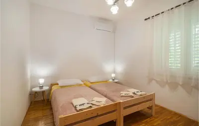 Krevet ili kreveti u jedinici u objektu 2 Bedroom Beautiful Apartment In Supetar