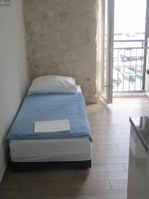 Krevet ili kreveti u jedinici u objektu Apartmani Nona