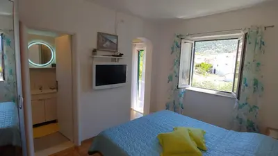 TV i/ili zabavni centar u objektu Studio apartment in Bol with balcony, air conditioning, WiFi, washing machine 3634-3