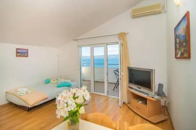 TV i/ili zabavni centar u objektu Apartment in Dugi Rat with sea view, terrace, air conditioning, WiFi 5113-4