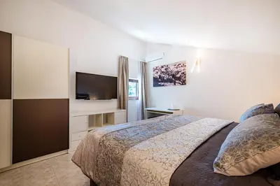 Krevet ili kreveti u jedinici u objektu Villa Kadena - Luxury Seaside Villa with Private Heated Pool