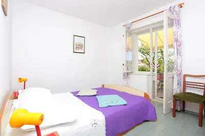 Krevet ili kreveti u jedinici u objektu Apartments by the sea Brela, Makarska - 20598