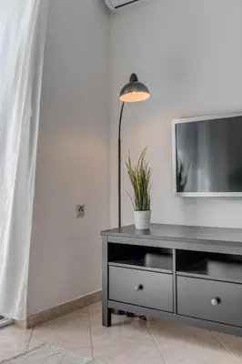 TV i/ili zabavni centar u objektu Apartment Beach