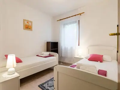 Krevet ili kreveti u jedinici u objektu Apartments Villa Pelegrin