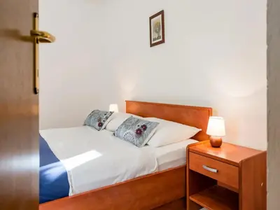 Krevet ili kreveti u jedinici u objektu Apartments Villa Pelegrin