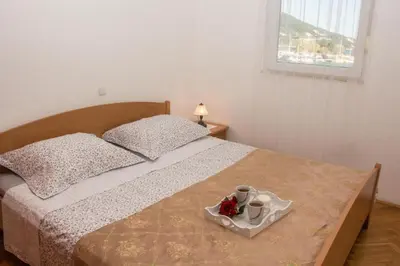 Krevet ili kreveti u jedinici u objektu Apartments with parking space Omis - 21050